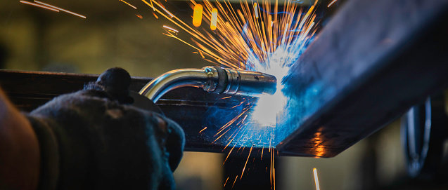 hands working with machinery